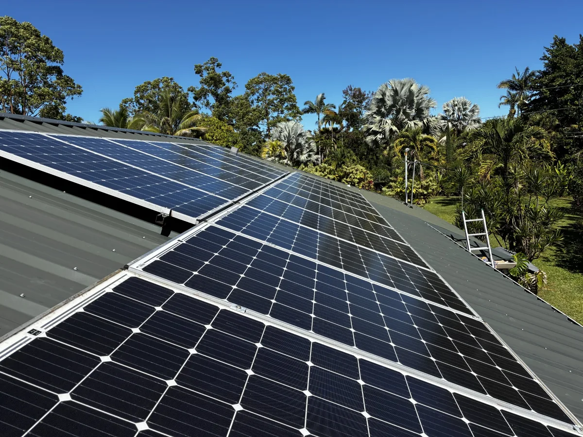 Pacific Energy and Electric rooftop solar installation in tropical surroundings